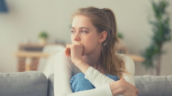 woman worried about a negative energy in house
