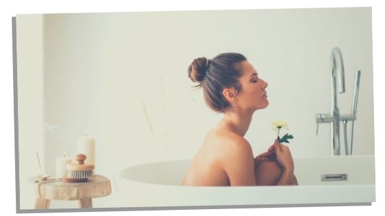 Woman in bath manifesting with water